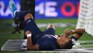 Paris Saint-Germain's French forward Kylian Mbappe reacts following an injury during the French L1 football match between Paris Saint-Germain (PSG) and Toulouse (TFC) at the Parc des Princes stadium in Paris, on August 25, 2019. / AFP / FRANCK FIFE