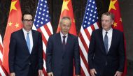 In this file photo taken on July 30, 2019, Chinese Vice Premier Liu He (C), US Trade Representative Robert Lighthizer (R) and Treasury Secretary Steve Mnuchin pose for photos before holding talks at the Xijiao Conference Center in Shanghai AFP / Pool / Ng