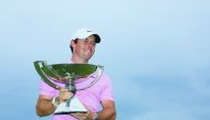 ory McIlroy of Northern Ireland celebrates with the FedExCup trophy after winning during the final round of the TOUR Championship at East Lake Golf Club on August 25, 2019 in Atlanta, Georgia. Sam Greenwood/Getty Images/AFP