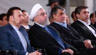 A handout picture provided by the Iranian presidency on August 27, 2019, shows President Hassan Rouhani (2 L) attending a ceremony in the capital Tehran. AFP PHOTO / HO / IRANIAN PRESIDENCY