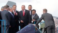 Russian President Vladimir Putin (3rd L) and his Turkish counterpart Recep Tayyip Erdogan (4th R) inspect Sukhoi Su-57 fifth-generation fighter during the MAKS-2019 International Aviation and Space Salon opening ceremony in Zhukovsky outside Moscow on Aug
