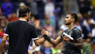 Roger Federer of Switzerland shakes hands with Sumit Nagal of India after their Men's Singles first round match on day one of the 2019 US Open at the USTA Billie Jean King National Tennis Center on August 26, 2019 in the Flushing neighborhood of the Queen