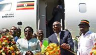 Uganda’s Prime Minister Ruhakana Rugunda (2R) flanked by Minister of World and Transprt Eng. Monica Azuba Ntege (2L) and the State Minister for Tourism Godfrey Kiwanda (R) take part in the launching ceremony of Uganda Airline’s maiden flight to Jomo Kenya
