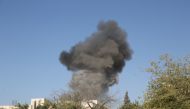 Smoke rises after Assad Regime forces carried out airstrikes over Ma'ar Shoreen village of Idlib, Syria on August 27, 2019. Izeddin Idilbi - Anadolu 