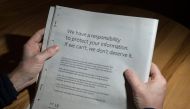 A man reads advertisement taken out by Mark Zuckerberg of Facebook to apologise for the leak of personal data on the backpage of a newspaper in Ripon, England, on March 25, 2018. AFP/Oli Scarff