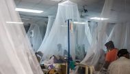Relatives remain with patients infected with dengue fever in the San Juan de Dios Hospital in Esteli, Nicaragua, on August 25, 2019.  AFP /