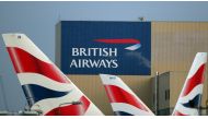 FILE PHOTO: British Airways logos are seen on tail fins at Heathrow Airport in west London, Britain, February 23, 2018. REUTERS/Hannah McKay/File Photo
