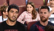 Barcelona's Uruguayan forward Luis Suarez (L) and Barcelona's Argentine forward Lionel Messi sit in the tribune during the Spanish League football match between Barcelona and Real Betis at the Camp Nou stadium in Barcelona on August 25, 2019. / AFP / Jose
