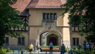 In this file photo taken on August 02, 2019 Tourists visit Cecilienhof palace in Potsdam on August 2, 2019. AFP / Odd Andersen 
