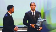 Liverpool's Virgil van Dijk with the UEFA Men’s Player of the Year award. Reuters/Eric Gaillard 