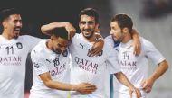 Al Sadd’s Al Asad (centre) celebrates with team-mates after scoring their opening goal against Saudi Arabia’s Al Ahli during the AFC Champions League Group D match played in Doha.