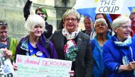 Joanna Cherry (C), Scottish National Party (SNP) MP poses with anti-Brexit protestors outside the Court Of Session in Edinburgh, Scotland on August 30, 2019. AFP / Andy Buchanan