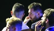 Argentine forward Lionel Messi (R) speaks with Portuguese forward Cristiano Ronaldo (L) during the UEFA Champions League football group stage draw ceremony in Monaco on August 29, 2019. AFP / Valery Hache
