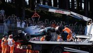 The damaged car of Mercedes' British driver Lewis Hamilton is lifted unto a truck after he crashed into a wall during the third practice session at the Spa-Francorchamps circuit in Spa on August 31, 2019 ahead of the Belgian Formula One Grand Prix. / AFP 