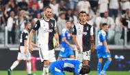Napoli's Kalidou Koulibaly looks dejected after scoring an own goal and Juventus' fourth as Juventus' Leonardo Bonucci and Paulo Dybala walk towards him REUTERS/Massimo Pinca 