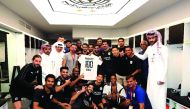 Al Sadd players and officials celebrate Hassan Al Haydos 100 goal milestone for Al Sadd.