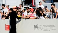 Director Yonfan signs autographs at the 76th Venice Film Festival, September 2, 2019. Reuters/Piroschka van de Wouw