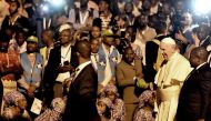 Pope Francis attends a welcome ceremony flanked by Mozambique President Filipe Nyusi upon his arrival at the Maputo International Airport on September 4, 2019. AFP / Tiziana Fabi 
