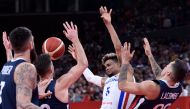 Dominican Republic's Victor Liz (C) fights for the ball with France's Paul Lacombe (R) and France's Vincent Poirier (L) during the Basketball World Cup Group G game between Dominican Republic and France in Shenzhen on September 5, 2019. AFP / Nicolas Asfo