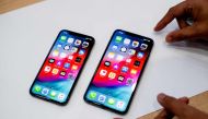 An Apple iPhone Xs Max and iPhone Xs rest on a table during a launch event on September 12, 2018 in Cupertino, California. AFP / Noah Berger