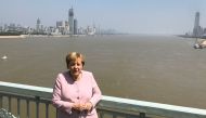 German Chancellor Angela Merkel poses for pictures on a bridge crossing the Yangtze River in Wuhan, China September 7, 2019. REUTERS/Andreas Rinke