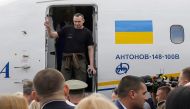 Ukrainian film director Oleg Sentsov disembarks from a plane on September 7, 2019 at Boryspil international airport in Kiev after a long-awaited exchange of prisoners between Moscow and Kiev,  AFP / Anatolii STEPANOV
