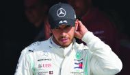 Third placed Mercedes' British driver Lewis Hamilton arrives on the podium after the Italian Formula One Grand Prix at the Autodromo Nazionale circuit in Monza on September 8, 2019. / AFP / Andrej Isakovic
