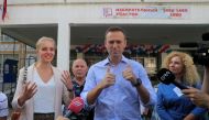 Russian opposition leader Alexei Navalny and his daughter Daria meet with journalists outside a polling station during the Moscow city parliament election in Moscow, Russia September 8, 2019. REUTERS/Tatyana Makeyeva
