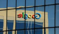 The Google logo is shown reflected on an adjacent office building in Irvine, California, August 7, 2017. Reuters/Mike Blake