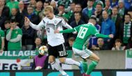 Germany's midfielder Julian Brandt (L) takes on Northern Ireland's midfielder Gavin Whyte (R) during the the Euro 2020 football qualification match between Northern Ireland and Germany at Windsor Park in Belfast on September 9, 2019. / AFP / Paul Faith