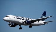 An Airbus A320-214 aircraft, operated by Aigle Azur, lands at Orly Airport near Paris, France, September 6, 2019. REUTERS/Benoit Tessier