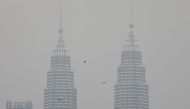 Petronas Twin Towers are shrouded by haze in Kuala Lumpur, Malaysia, September 9, 2019. Picture taken on September 9, 2019. REUTERS/Lim Huey Teng