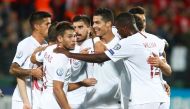 Portugal's Cristiano Ronaldo celebrates scoring their second goal with teammates. REUTERS/Ints Kalnins