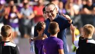 Juventus' Italian coach Maurizio Sarri greets boys at the end of the Italian Serie A football match Fiorentina vs Juventus on September 14, 2019 at the Artemio-Franchi stadium in Florence. / AFP / Vincenzo PINTO