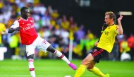 Arsenal's French-born Ivorian midfielder Nicolas Pepe (L) vies with Watford's English defender Craig Dawson during the English Premier League football match between Watford and Arsenal at Vicarage Road Stadium in Watford, north of London on September 15, 