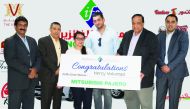 Officials with the winner of Mitsubishi Pajero. 