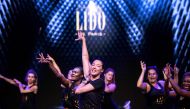 Lido dancer Victoria (C) conducts a 'bootcamp' workshop on the stage of the Lido cabaret in Paris on September 10, 2019. AFP / Christophe Archambault 