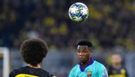 Barcelona´s Guinea-Bissau forward Ansu Fati (R) and Dortmund's Belgian midfielder Axel Witsel (L) vie for the ball during the UEFA Champions League Group F football match Borussia Dortmund v FC Barcelona in Dortmund, western Germany, on September 17, 2019