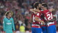 Granada's players celebrate their win at the end of the Spanish league football match between Granada FC and FC Barcelona at Nuevo Los Carmenes stadium in Granada on September 21, 2019. / AFP / JORGE GUERRERO