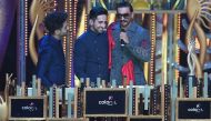 Bollywood actor Aparshakti Khurrana (L) looks on as his brother Ayushmann Khurrana (C) and actor Ranveer Singh interact on stage during the 20th International Indian Film Academy (IIFA) Awards at NSCI Dome in Mumbai on September 18, 2019. / AFP / INDRANIL
