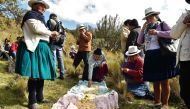 Ecuadorean indigenous people share a traditional lunch in Quimsacocha, Azuay province, Ecuador, on September 2, 2019. AFP/Rodrigo Buendia