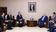  Syria's Foreign Minister Walid al-Moallem (C-R) meeting with United Nations special envoy to Syria Geir Pedersen(C-L) in the Syrian capital Damascus on September 23, 2019.   AFP / SANA