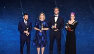 FC Barcelona's Lionel Messi poses after winning the Best FIFA Men's player award with the winner of the Best FIFA Men's coach award Liverpool manager Juergen Klopp, winner of the Best FIFA Women's player award USA women's Megan Rapinoe and the winner of t