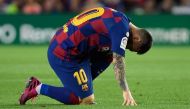 Barcelona's Argentine forward Lionel Messi reacts on the ground during the Spanish league football match between FC Barcelona and Villarreal CF at the Camp Nou stadium in Barcelona, on September 24, 2019. / AFP / LLUIS GENE