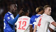 Brescia's Italian forward Mario Balotelli gestures towards Juventus fans during the Italian Serie A football match Brescia vs Juventus on September 24, 2019 at the Mario-Rigamonti stadium in Brescia. / AFP / Marco Bertorello