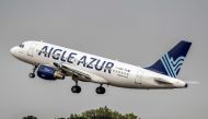 An Airbus A319 aircraft of French airline Aigle Azur belonging to the Weaving group taking off from Lille Airport in Lesquin, northern France, on August 25, 2017. AFP / Philippe Huguen
 