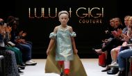 Model Daisy-May Demetre presents a creation by Designer Eni Hegedus-Buiron for luxury children's wear label Lulu et Gigi during Paris Fashion Week in Paris, France, September 27, 2019. REUTERS/Gonzalo Fuentes