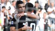 Juventus' Portuguese forward Cristiano Ronaldo celebrates with Juventus' Argentine forward Paulo Dybala after scoring during the Italian Serie A football match Juventus vs Spal on September 28, 2019 at the Juventus stadium in Turin. / AFP / Andreas SOLARO