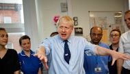 FILE PHOTO: Britain's Prime Minister Boris Johnson visits the North Manchester General Hospital before the start of Conservative Conference, in Manchester, Britain September 29, 2019. Andy Stenning/Pool via REUTERS/File Photo