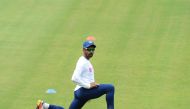 Indian cricketer Wriddhiman Saha stretches during a practice session ahead of the first test match between India and South Africa at the Dr. Y.S. Rajasekhara Reddy ACA-VDCA Cricket Stadium in Visakhapatnam on September 30, 2019. AFP / NOAH SEELAM 